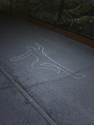 Contour of a person drawn at the asphalt