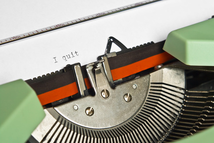 Close-up of an old typewriter with the word "I quit" typed